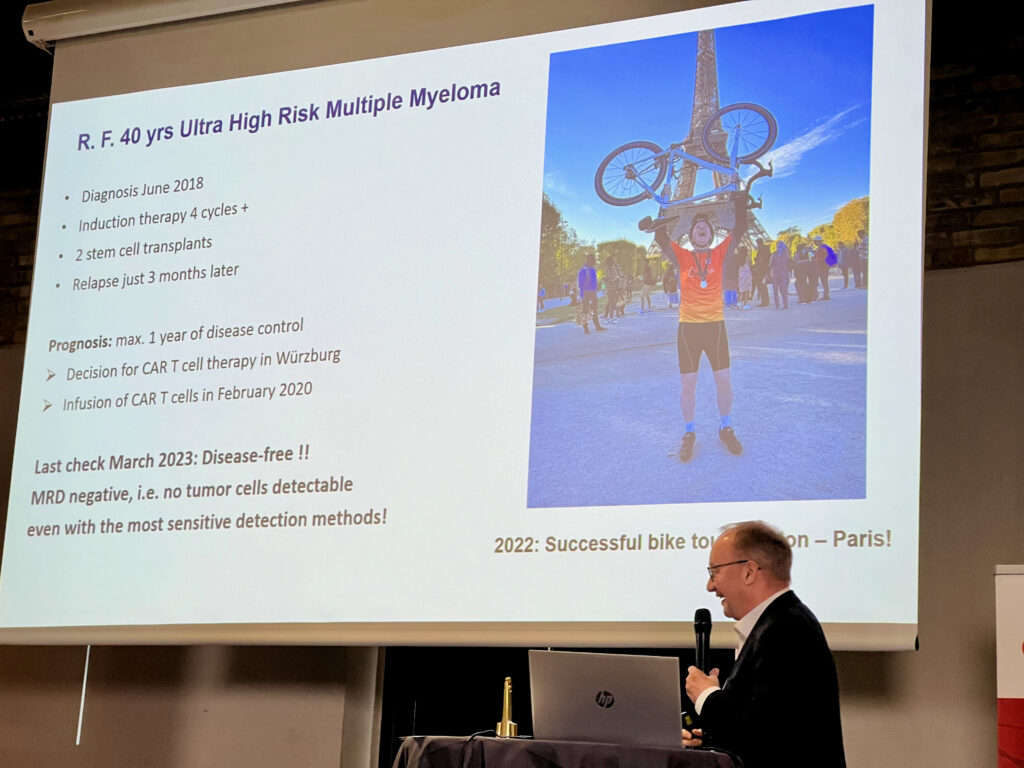 Foto af professor Hermann Einsele der viser hvordan en 40 år gammel myelomatosepatient, hvor intet andet virker, nu lever i bedste velgående og deltog i cykelløbet London-Paris.
